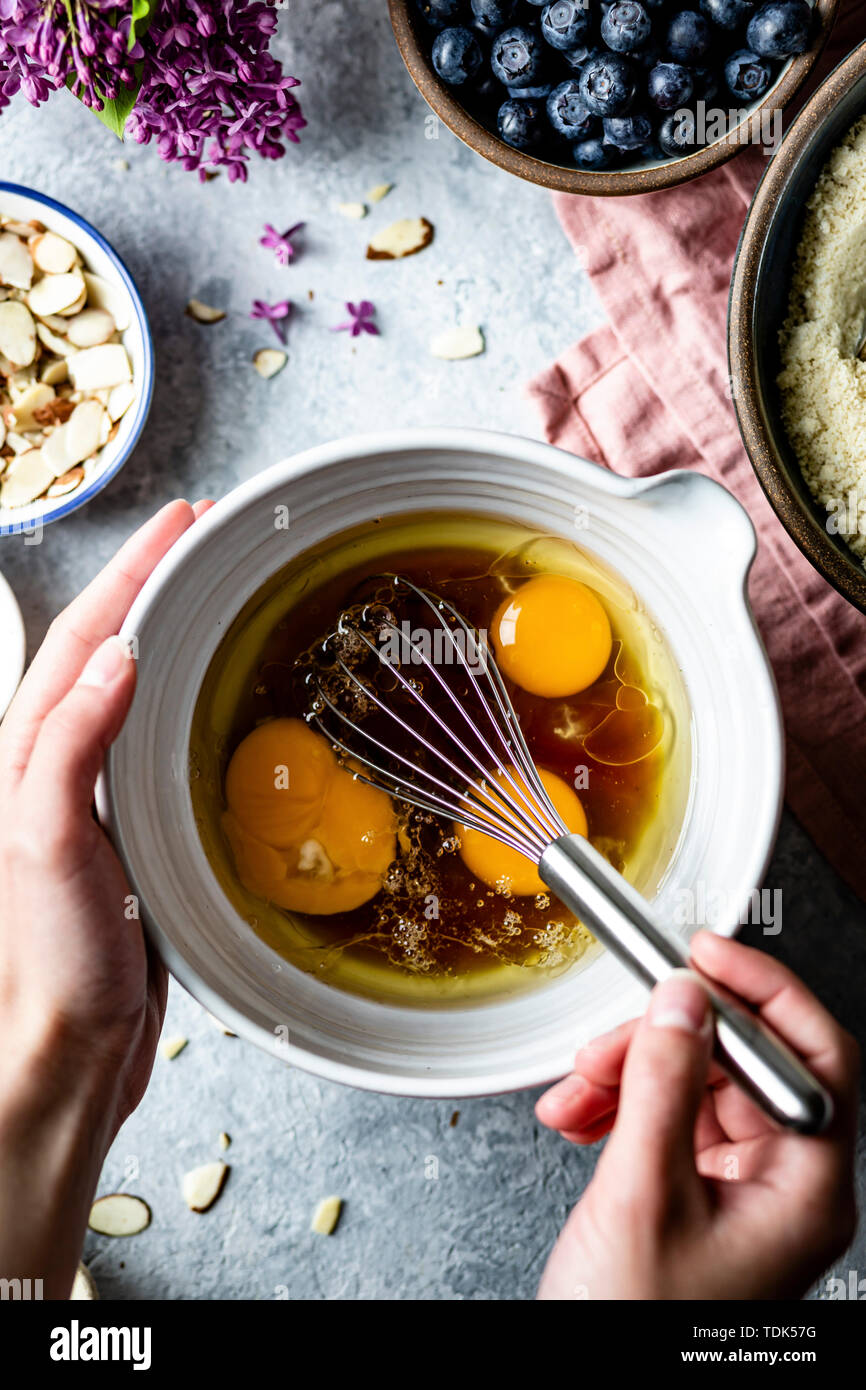 Mixing egg yolks and maple syrup in a mixing bowl Stock Photo Alamy