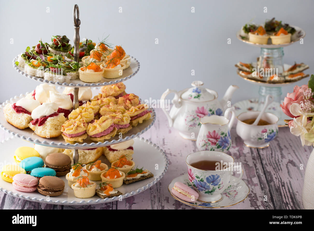 High Tea, or Afternoon Tea laid out on a table with traditional cups and  saucers Stock Photo - Alamy