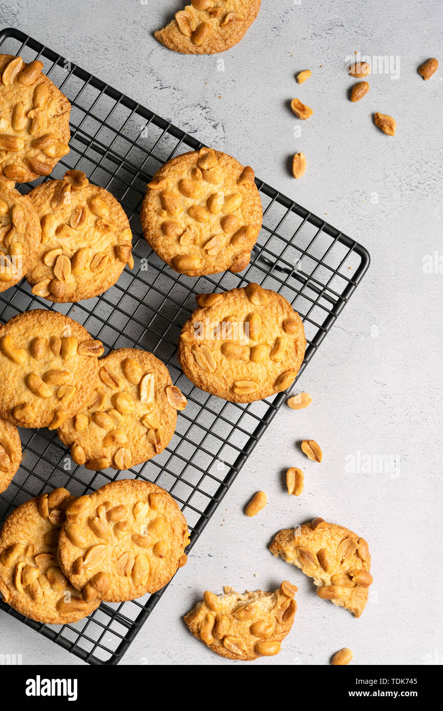 Crisp peanut cookies cooling on a wire rack Stock Photo - Alamy