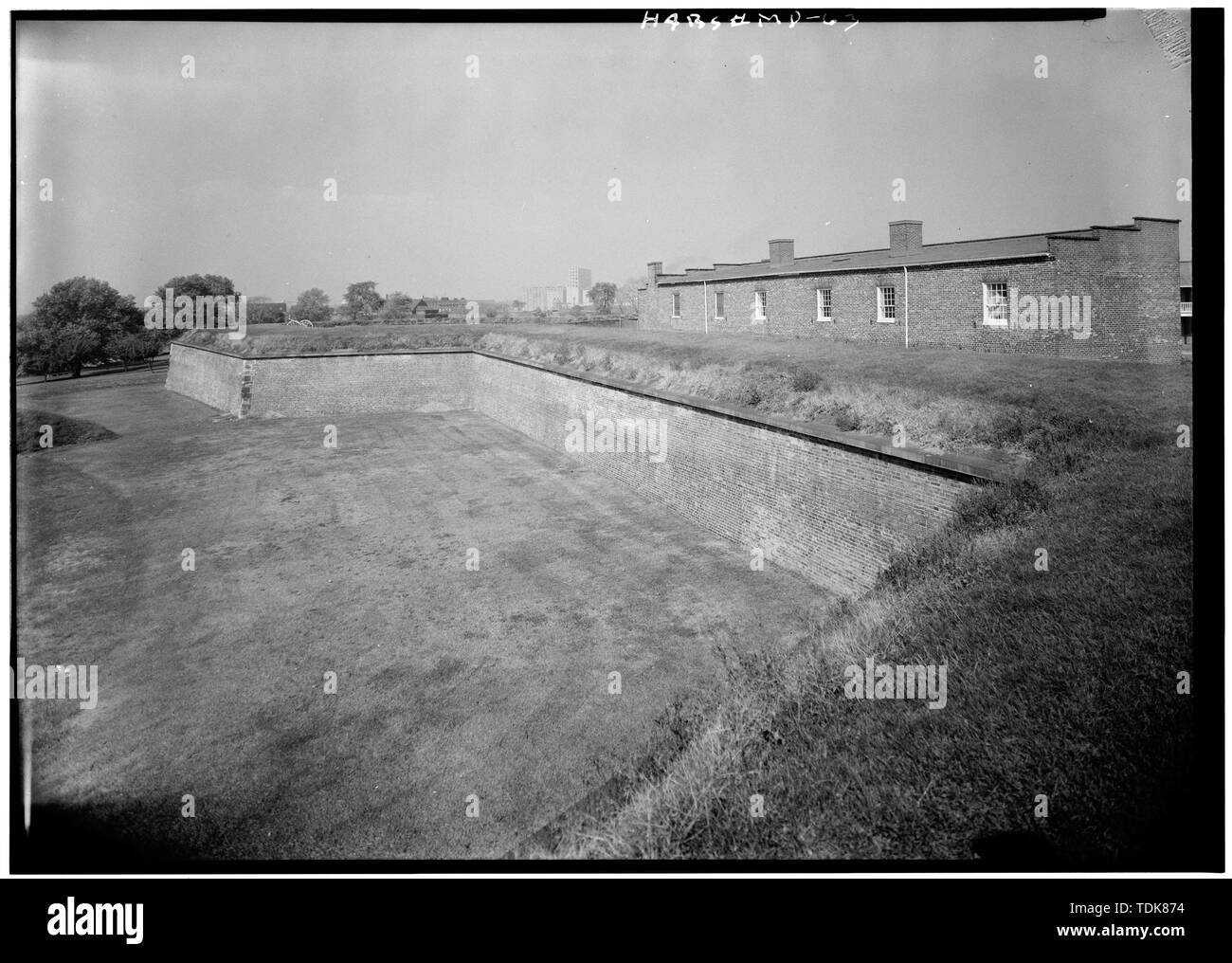 October 1958 SOUTHWEST BASTION FROM SOUTH BASTION, REAR OF NO. 1 SOLDIERS' BARRACKS (BUILDING D) AT RIGHT - Fort McHenry National Monument and Historic Shrine, East Fort Avenue at Whetstone Point, Baltimore, Independent City, MD; Fort Whetstone; Key, Francis Scott; Armistead, George; Pickersgill, Mary; Foncin, Jean; U.S. Navy, photographer; Peterson, Charles E., photographer; Boucher, Jack E., photographer; Nelson, Lee H., historian; Carroll, Orville W., delineator; Nelson, Harold A., delineator; Nelson, Trevor, delineator; Barr, Benjamin F., delineator; Wrenn, George L., delineator Stock Photo