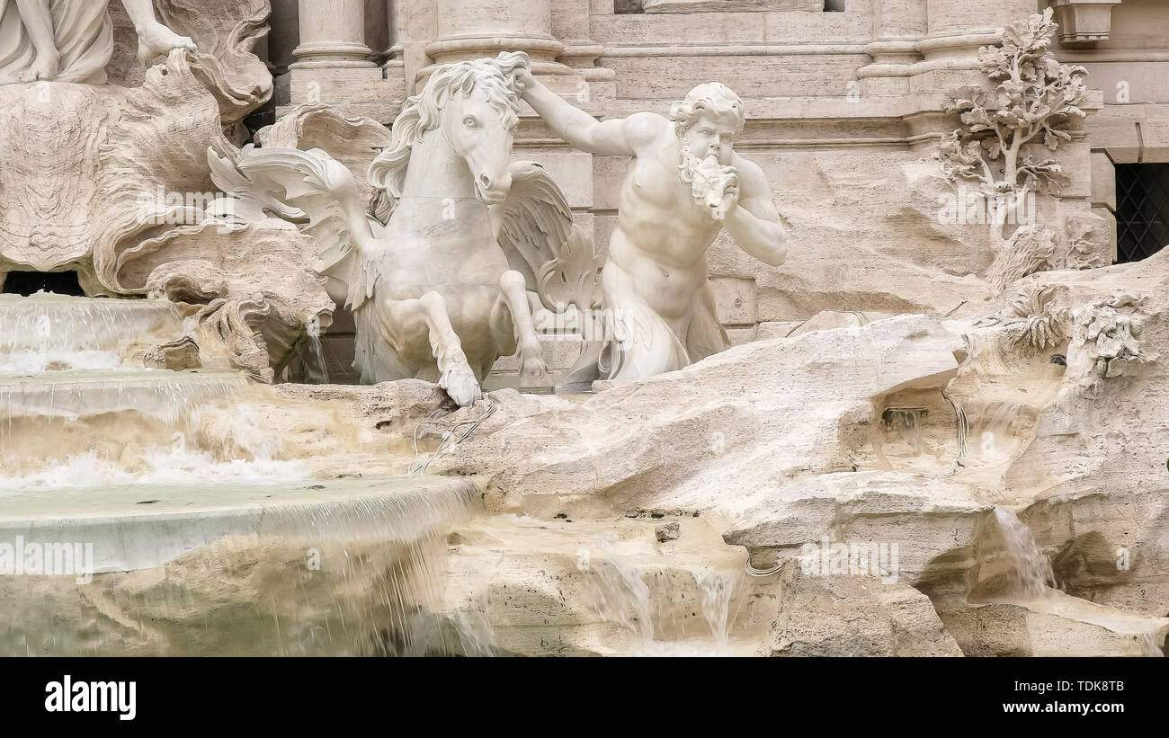 close up of a horse and triton statue at trevi fountain in rome, italy Stock Photo