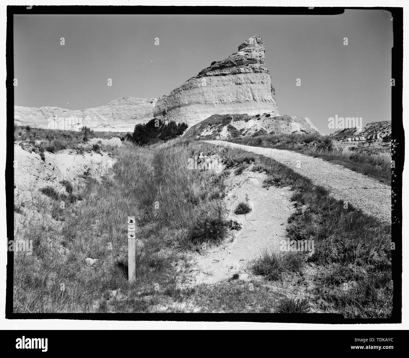 Oregon Trail, original cut and marker post. View E. Scotts Bluff