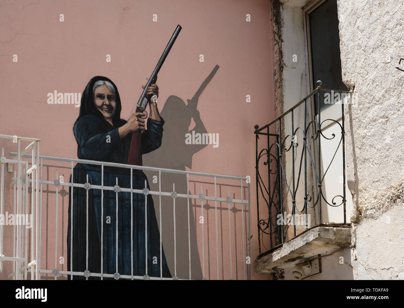 Oliena, Italy. 08th June, 2019. A wall painting painted on a house wall showing Maria Palimodde by the artist Luigi Columbu is one of the famous large-format murals 'Murales' in the streets of this region. Topics are both international events such as the Vietnam War, the partisan struggle during fascism and local events. One of the most important is the successful struggle of the population against a military training area planned by NATO in 1969 on the Pratobello plateau. Credit: Jens Kalaene/dpa-Zentralbild/ZB/dpa/Alamy Live News Stock Photo