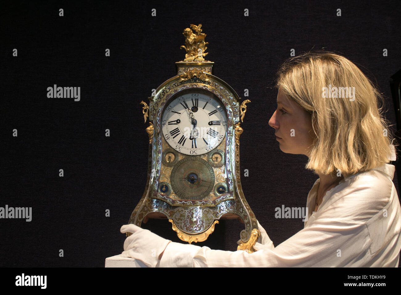 Bonhams London, 17th June 2019. An exceptionally fine and rare mid 18th century Czech cut-brass and pewter inlaid, musical clock playing six tunes on 13 bells and hammers, with annual calendar and automata star, Joseph Graff Prague, £14,000-18,000. Bonhams photocall of the World's Most valuable clocks from the Clive Collection to appear at auction at Bonhams New Bond Street Stock Photo