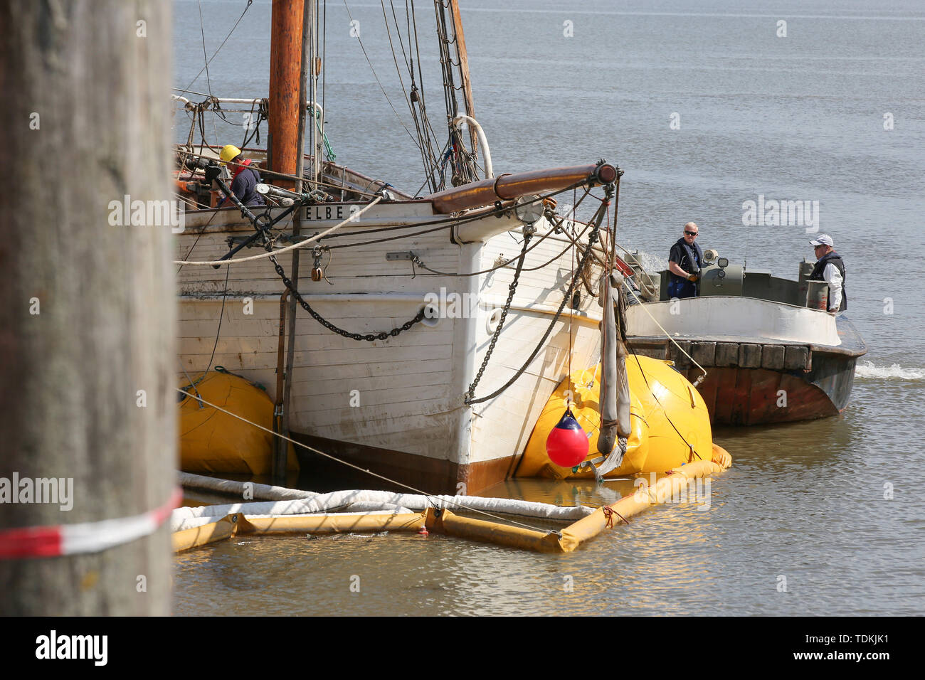 Stadersand, Germany. 17th June, 2019. The sailing ship No. 5 Elbe, which was lifted last night, lies at the pier in Stadersand and is under investigation. The historic pilot schooner, which has only recently been extensively renovated, collided with a container ship on the Elbe and sank. Last night the ship was lifted with air cushions. Credit: Bodo Marks/dpa/Alamy Live News Stock Photo