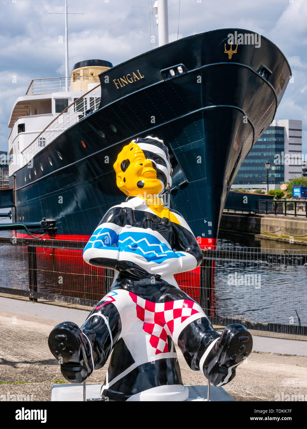 Leith, Edinburgh, Scotland, United Kingdom, 17 June 2019. Oor Wullie's Big Bucket Trail: An art trail of 200 Oor Wullie sculptures appear in Scottish cities in a mass arts event that lasts until August 30th. Oor Wullie is an iconic Scottish cartoon character from the Sunday Post newspaper. The sculptures will be auctioned to raise money for Scotland’s children’s charities There are 5 in the Leith area, and 60 in Edinburgh altogether. Bobby Dazzler by Scott Dawson and Rachel Miller in Alexandra Dock next to Fingal Edinburgh luxury floating hotel Stock Photo