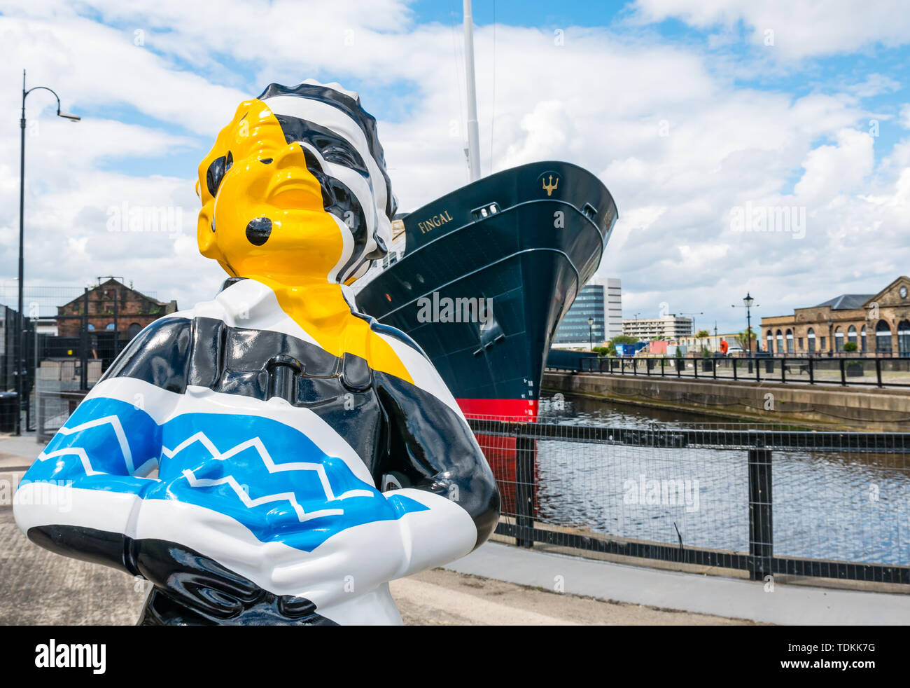 Leith, Edinburgh, Scotland, United Kingdom, 17 June 2019. Oor Wullie's Big Bucket Trail: An art trail of 200 Oor Wullie sculptures appear in Scottish cities in a mass arts event that lasts until August 30th. Oor Wullie is an iconic Scottish cartoon character from the Sunday Post newspaper. The sculptures will be auctioned to raise money for Scotland’s children’s charities There are 5 in the Leith area, and 60 in Edinburgh altogether. Bobby Dazzler by Scott Dawson and Rachel Miller in Alexandra Dock next to Fingal Edinburgh luxury floating hotel Stock Photo