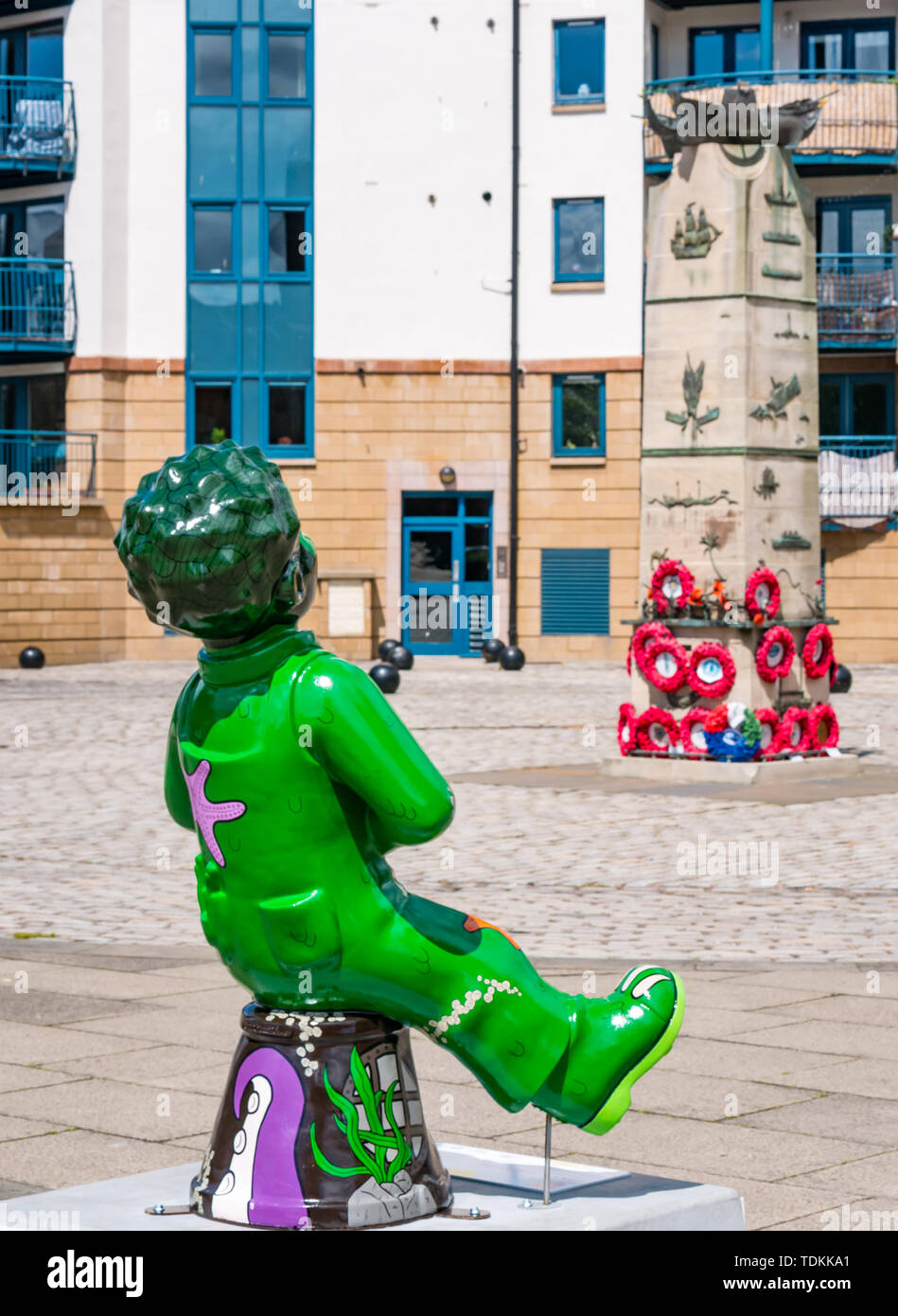 Leith, Edinburgh, Scotland, United Kingdom, 17 June 2019. Oor Wullie's Big Bucket Trail: An art trail of 200 Oor Wullie sculptures appear in Scottish cities in a mass arts event that lasts until August 30th. Oor Wullie is an iconic Scottish cartoon character. The sculptures will be auctioned to raise money for Scotland’s children’s hospital charities There are 5 in the Leith area, and 60 in Edinburgh altogether. Oor Wullie by Ruairidh Brunton by the Scottish Merchant Seaman memorial Stock Photo