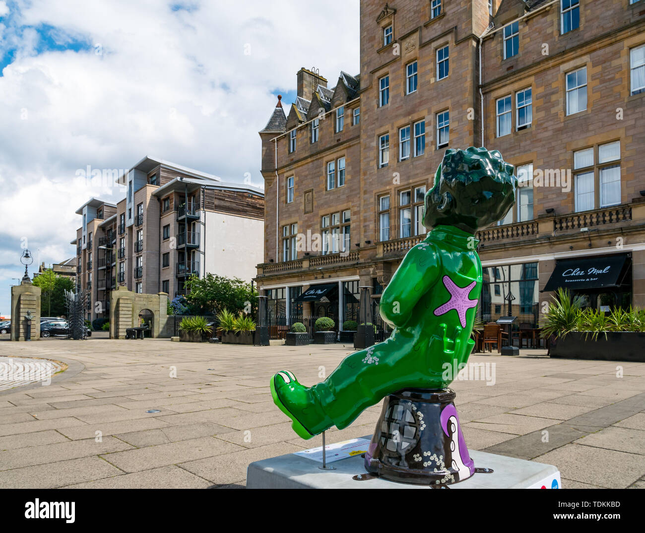 Leith, Edinburgh, Scotland, United Kingdom, 17 June 2019. Oor Wullie's Big Bucket Trail: An art trail of 200 Oor Wullie sculptures appear in Scottish cities in a mass arts event that lasts until August 30th. Oor Wullie is an iconic Scottish cartoon character. The sculptures will be auctioned to raise money for charities There are 5 in the Leith area, and 60 in Edinburgh altogether. Oor Wullie by Ruairidh Brunton outside Malmaison hotel in Tower lace Stock Photo
