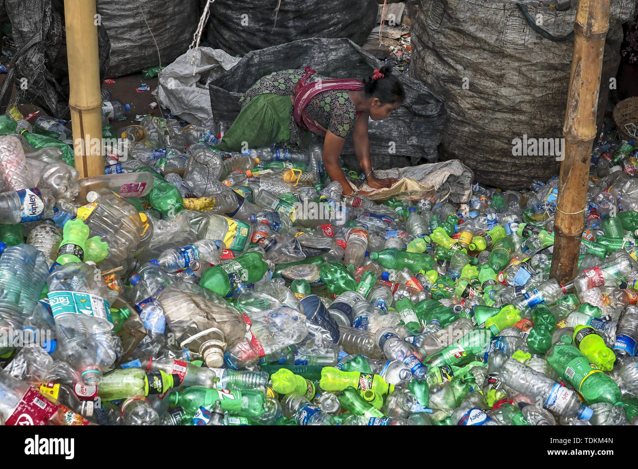 Dhaka, Bangladesh. 17th June, 2019. Women workers are sorting out plastics at a recycling factory in Dhaka, Bangladesh. Credit: Kazi Salahuddin/ZUMA Wire/Alamy Live News Stock Photo