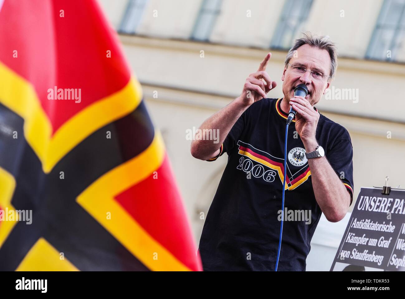 Munich, Bavaria, Germany. 17th June, 2019. MICHAEL STUERZENBERGER appearing at a Buergerbewegung Pax Europa far-right demonstration in Munich, Germany with the symbolic Wirmer flag in the foreground. Headed by the Verfassungsschutz (Secret Service) monitored Michael Stuerzenberger, the Buergerbewegung Pax Europa (Citizen Initiative Pax Europa) islamophobic group marched through the University area of Munich, Germany. Despite claiming to be for Judeo-Christian culture, the group had numerous known anti-semites, anti-semitic conspiracy theorists, and right-extremists among their 50 followers. Cr Stock Photo