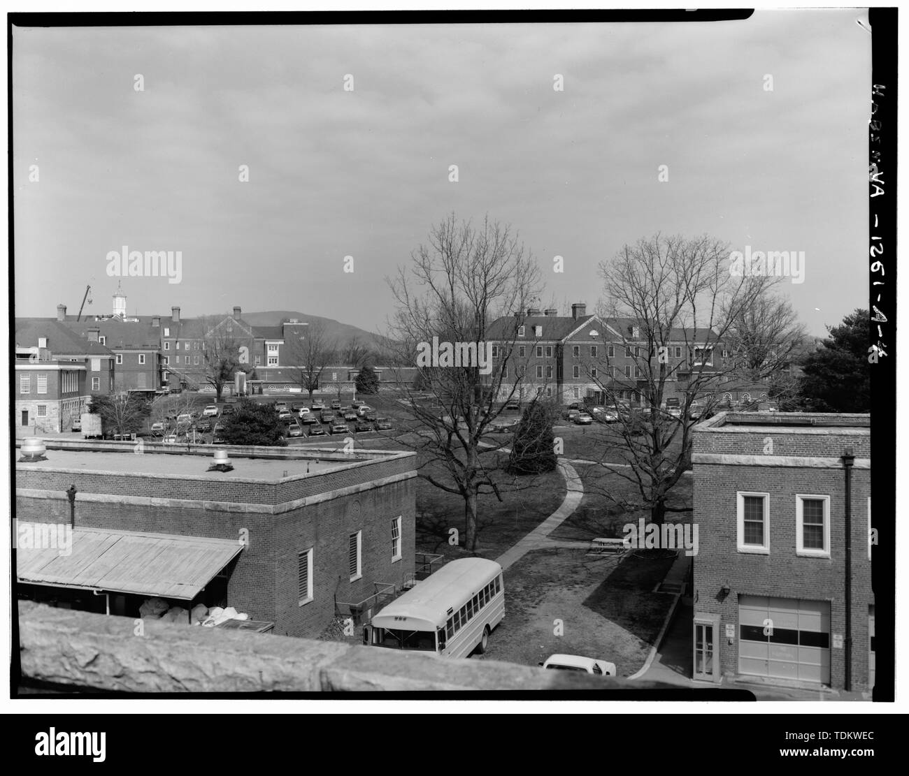 Oblique view north-northwest of southeast elevation (center of picture) from service buildings. Buildings -14 and -16 in forefront, Building -4 on left, and Building -2A in background and to the left of Building -6. - Roanoke Veterans Administration Hospital, Building No. 6, 1970 Roanoke Boulevard, Salem, Salem, VA; U.S. Department of Veterans Affairs Stock Photo