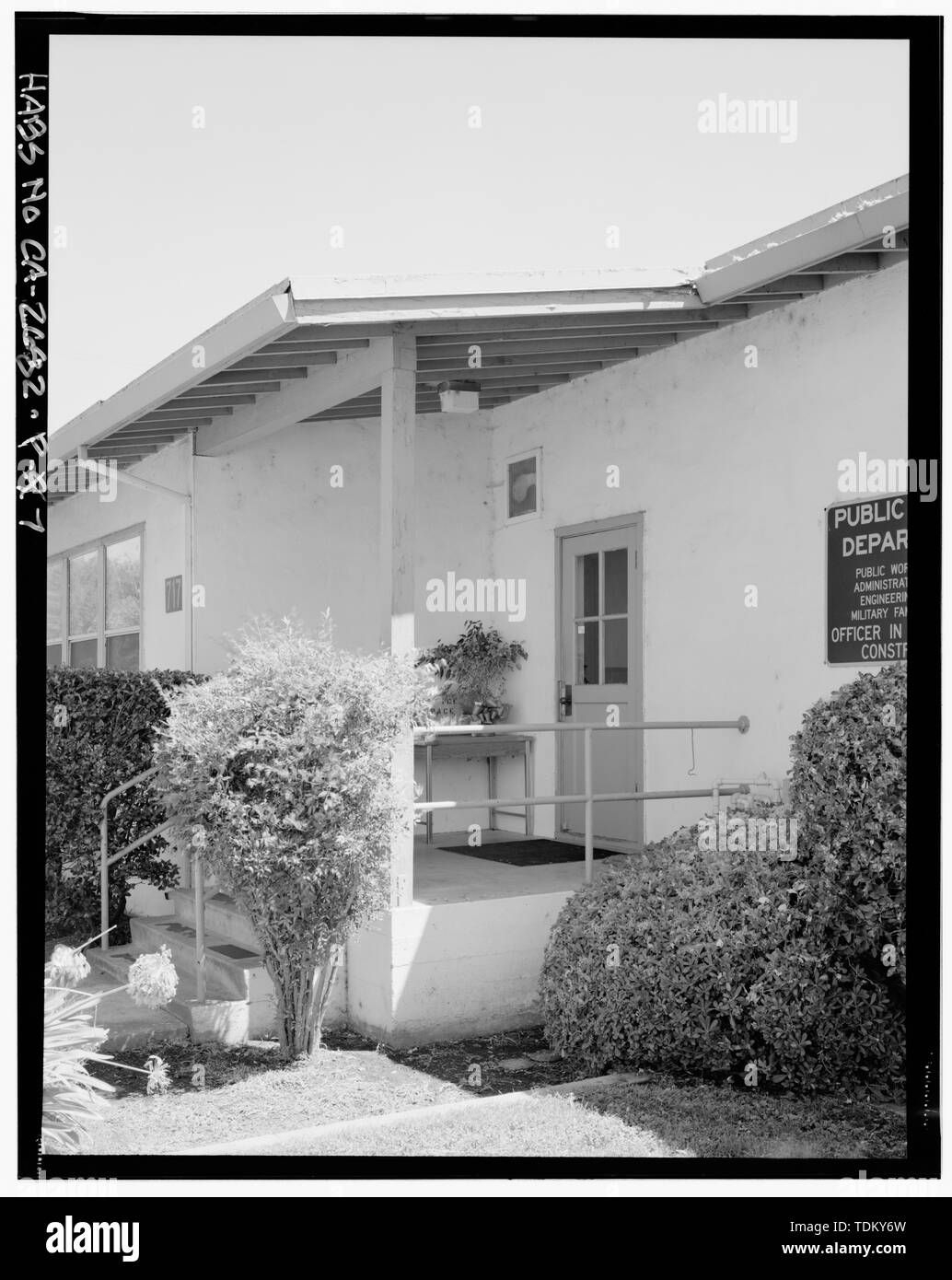 Oblique view of north elevation of building 710 with railroad tracks; camera facing east. - Naval Supply Annex Stockton, Public Works Offices, Southeast corner of Davis Avenue and Ellsberg Drive, Stockton, San Joaquin County, CA Stock Photo