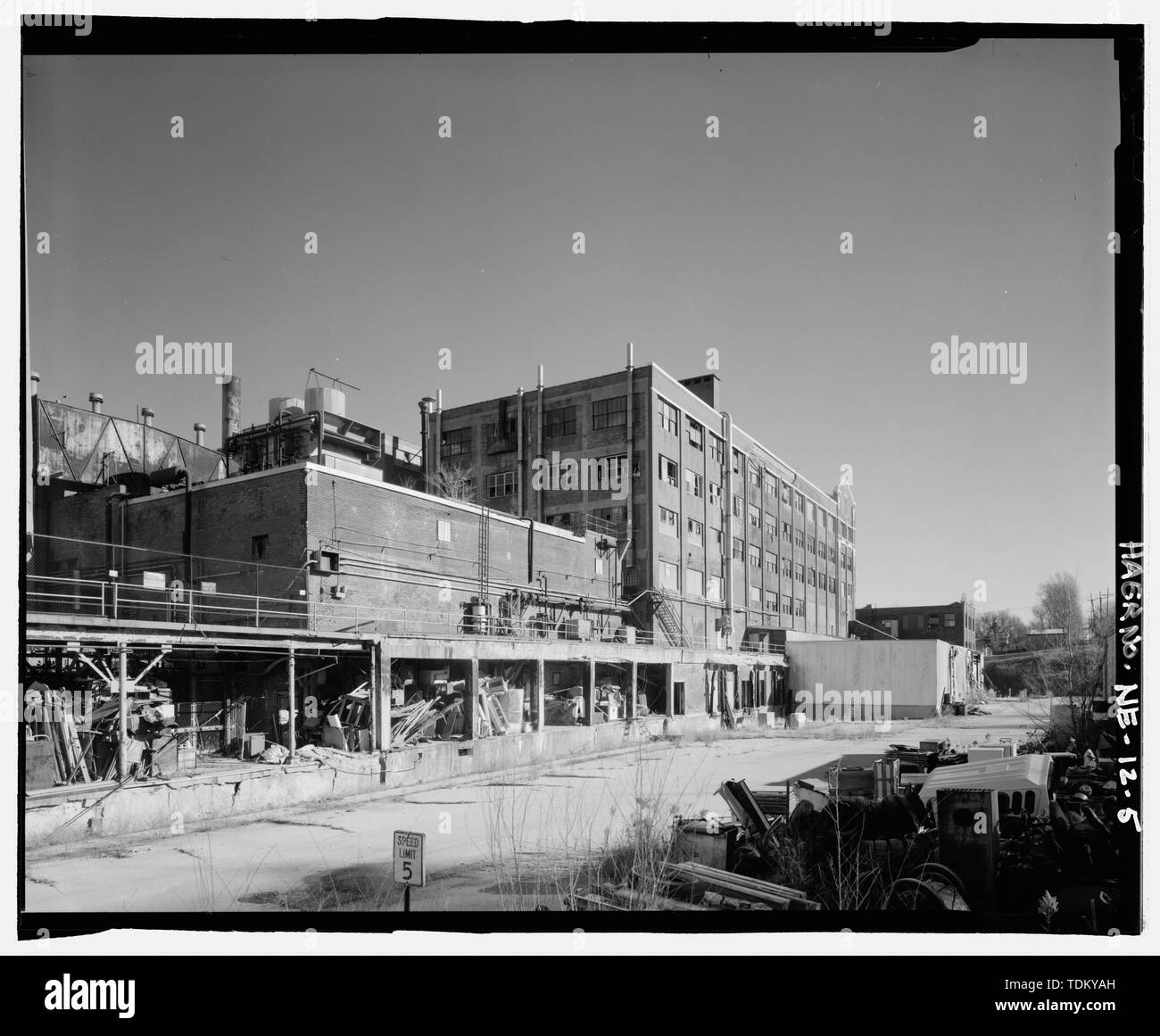 Oblique view of power plant and main plant looking east showing loading
