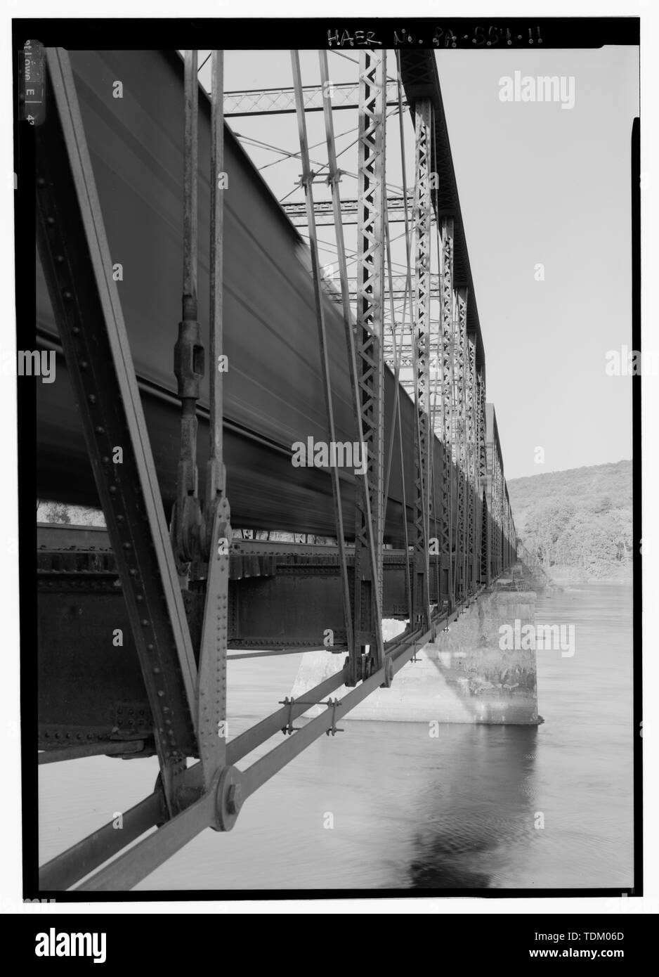 Oblique view of west channel spans, looking east, with train on bridge. - Pennsylvania Railroad, Selinsgrove Bridge, Spanning Susquehanna River, south of Cherry Island, Selinsgrove, Snyder County, PA; Brown, William H; A. and P. Roberts; Pencoyd Bridge and Construction Company; Cofrode and Saylor, Engineers and Bridge Builders; Pennsylvania Railroad; Consolidated Rail Corporation (Conrail); Norfolk Southern Railroad; Sunbury and Lewistown Railroad; Schuylkill and Juniata Railroad; Susquehanna College; DeLony, Eric N, project manager; Pennsylvania Historical and Museum Commission, sponsor; Cons Stock Photo