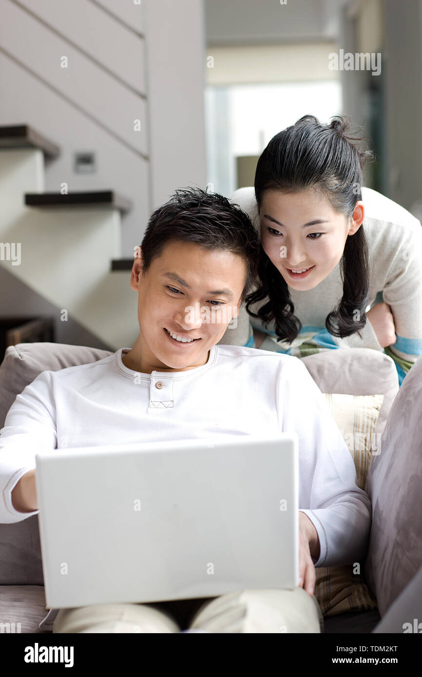 A couple using a laptop Stock Photo