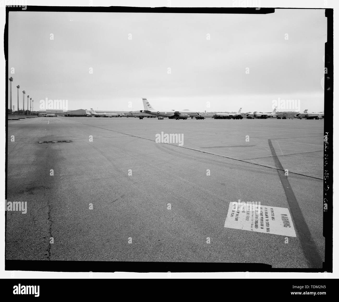 Overview of operational apron. Painted warning sign in foreground. View