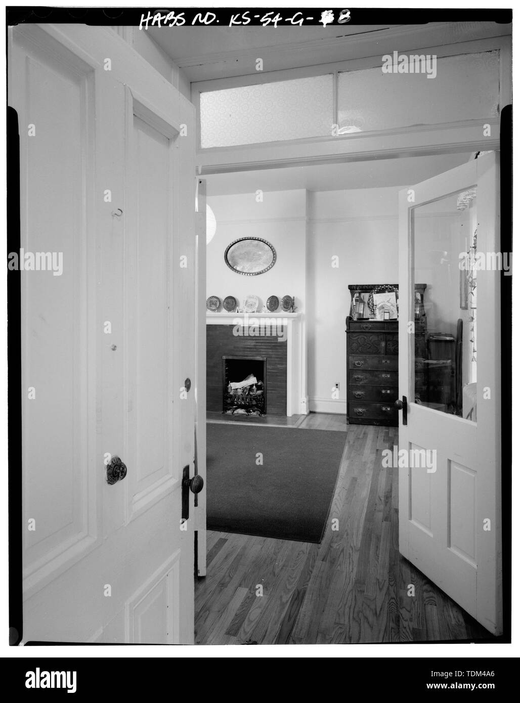 PARLOR, 16B, MAIN STAIRS AND DOOR (CLOSED) TO DINING ROOM. - Fort Riley, Building No. 16, 16 Forsythe Avenue, Riley, Riley County, KS; Goding, William; Pond, George E; Stair, W H; Miller; Oberg, John; Holmgreen, John; Pratt, H J; Bently, C E; Crawford, Catherine, field team; Glass, James A, project manager; Whye, Mike, photographer; Rodriguez, Joseph, historian Stock Photo