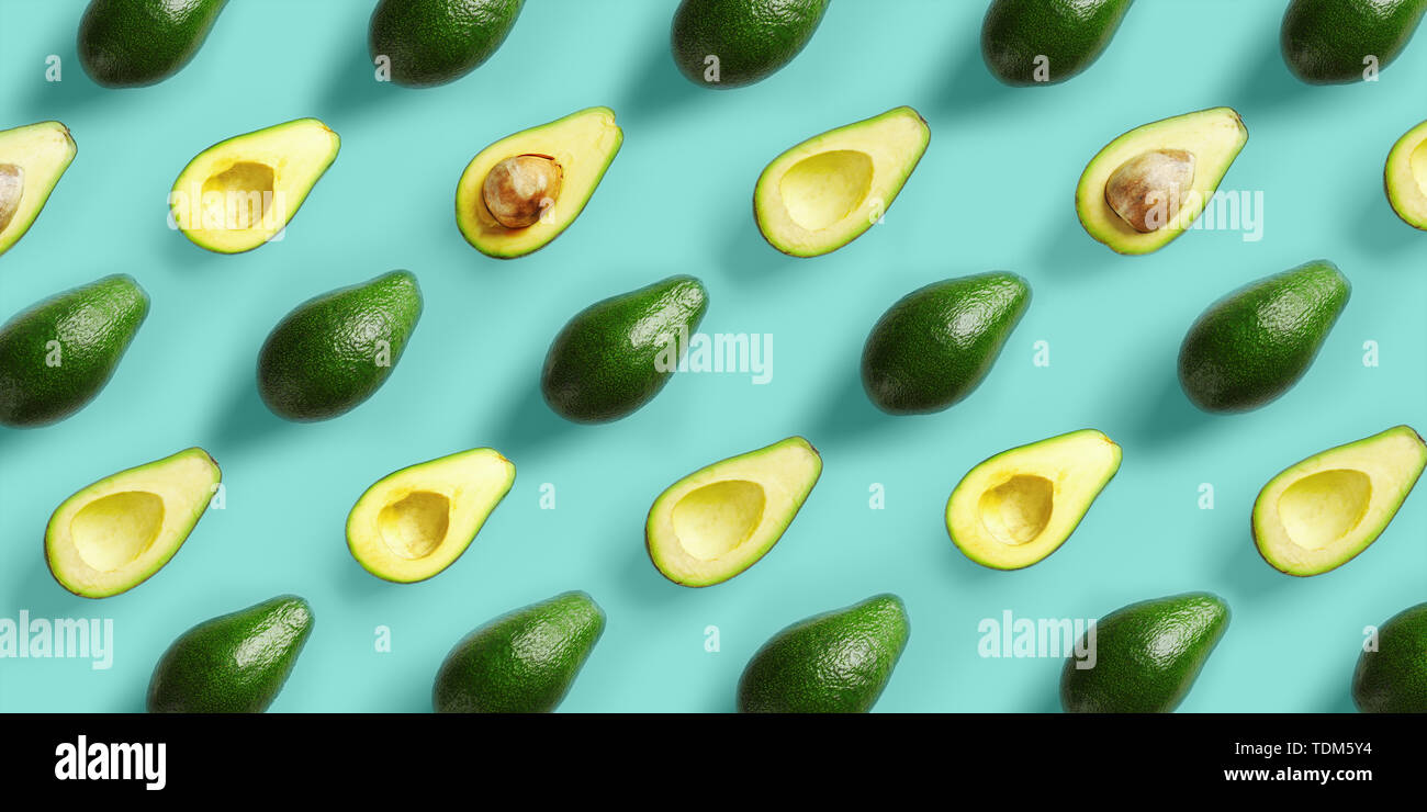 Avocado pattern on blue background. Pop art design, creative summer food concept. Green avocadoes, minimal flat lay style Stock Photo