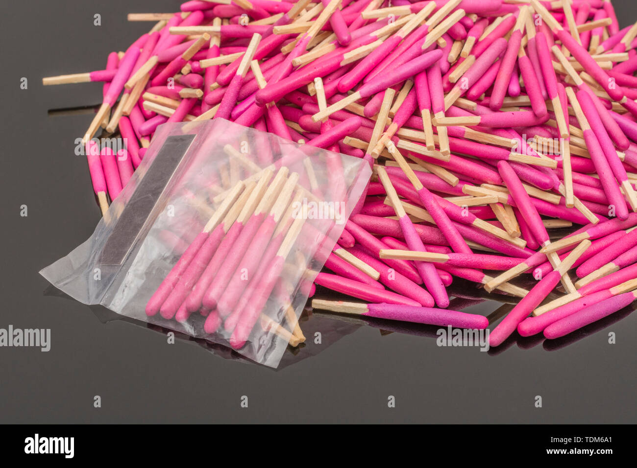 Random pile of waterproof emergency matches. Metaphor survival skills, chaotic mind, disorganized, random, lost in the crowd, untidy mind. Stock Photo
