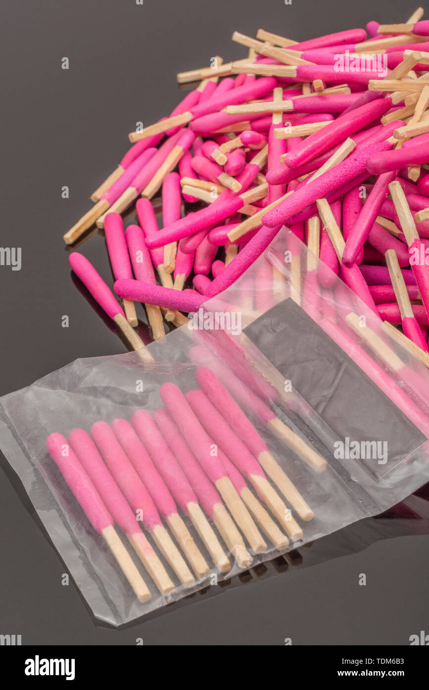 Random pile of waterproof emergency matches. Metaphor survival skills, chaotic mind, disorganized, random, lost in the crowd, untidy mind. Stock Photo