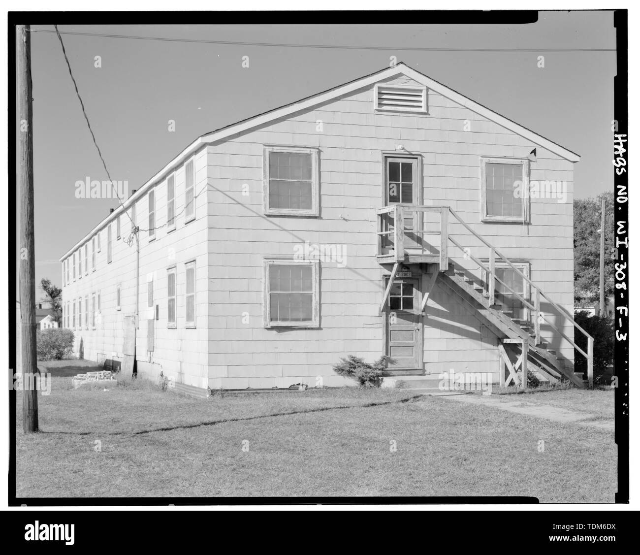 PERSPECTIVE VIEW OF EAST (FRONT) AND NORTH SIDE SHOWING EXTERIOR STAIR