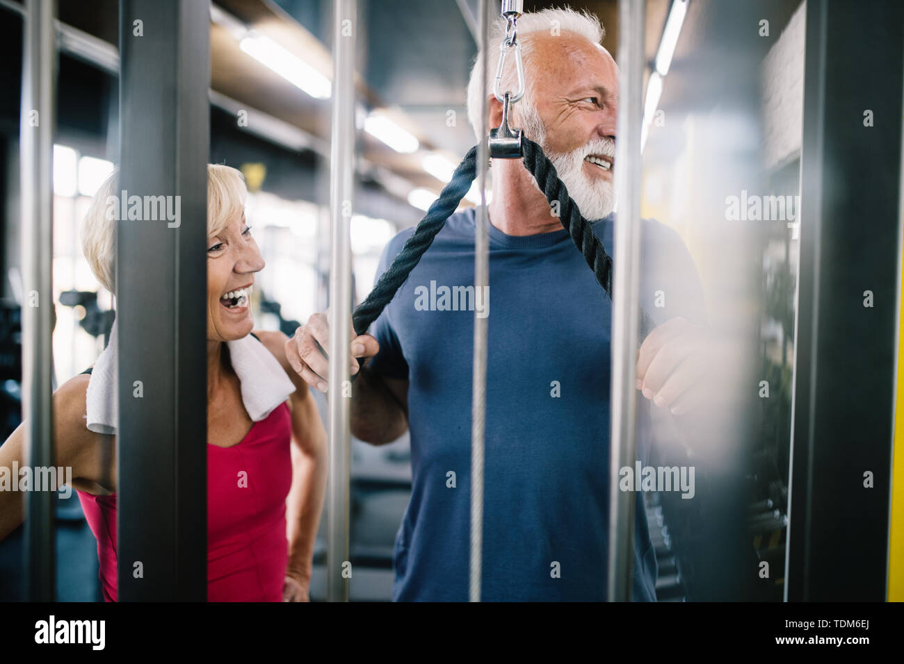 Vital mature couple exercising in the gym. Stock Photo