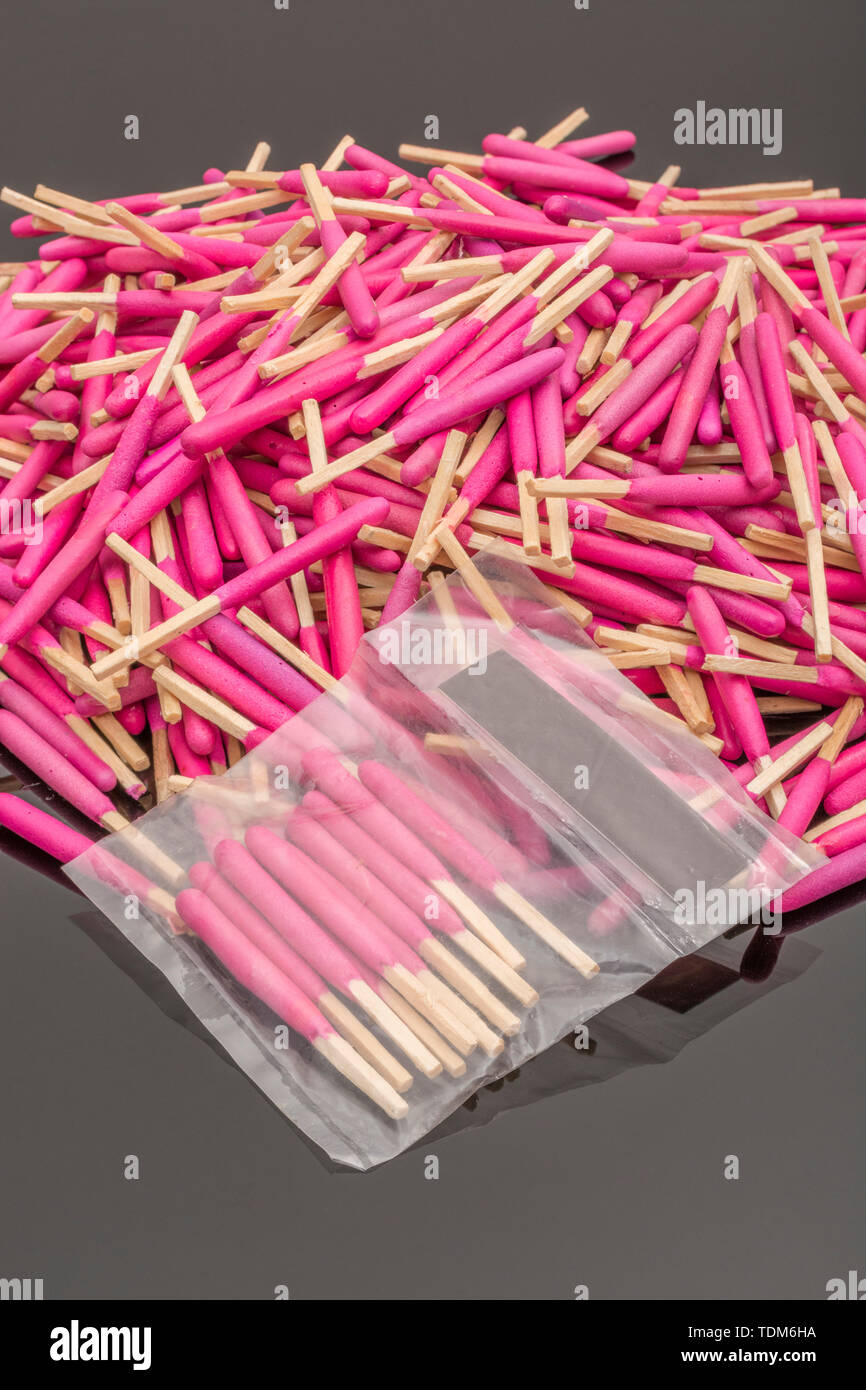 Random pile of waterproof emergency matches. Metaphor survival skills, chaotic mind, disorganized, random, lost in the crowd, untidy mind. Stock Photo