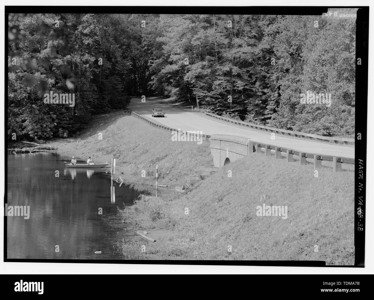 PARTIAL VIEW FROM SOUTHEAST OF JONES MILL POND DAM. - Colonial Parkway, Yorktown to Jamestown Island, Yorktown, York County, VA; Cramton, Louis C; Wilbur, Ray Lyman; Hoover, Herbert; Taylor, Oliver G; Peterson, Charles E; Smith, William H; Robinson, William; T E Ritter Company; Thomason, C Y; J G Attaway Construction Company; Wescott, Frank T; Tee, Nello D; A N Campbell and Company; Arundel Corporation; P T Withers; Sanford and Brooks, Company; Roberts Paving Company; Malpass Construction Company; W E Graham and Sons; Rea Construction Company; Scott, W H; Case Construction Company; Triotino an Stock Photo