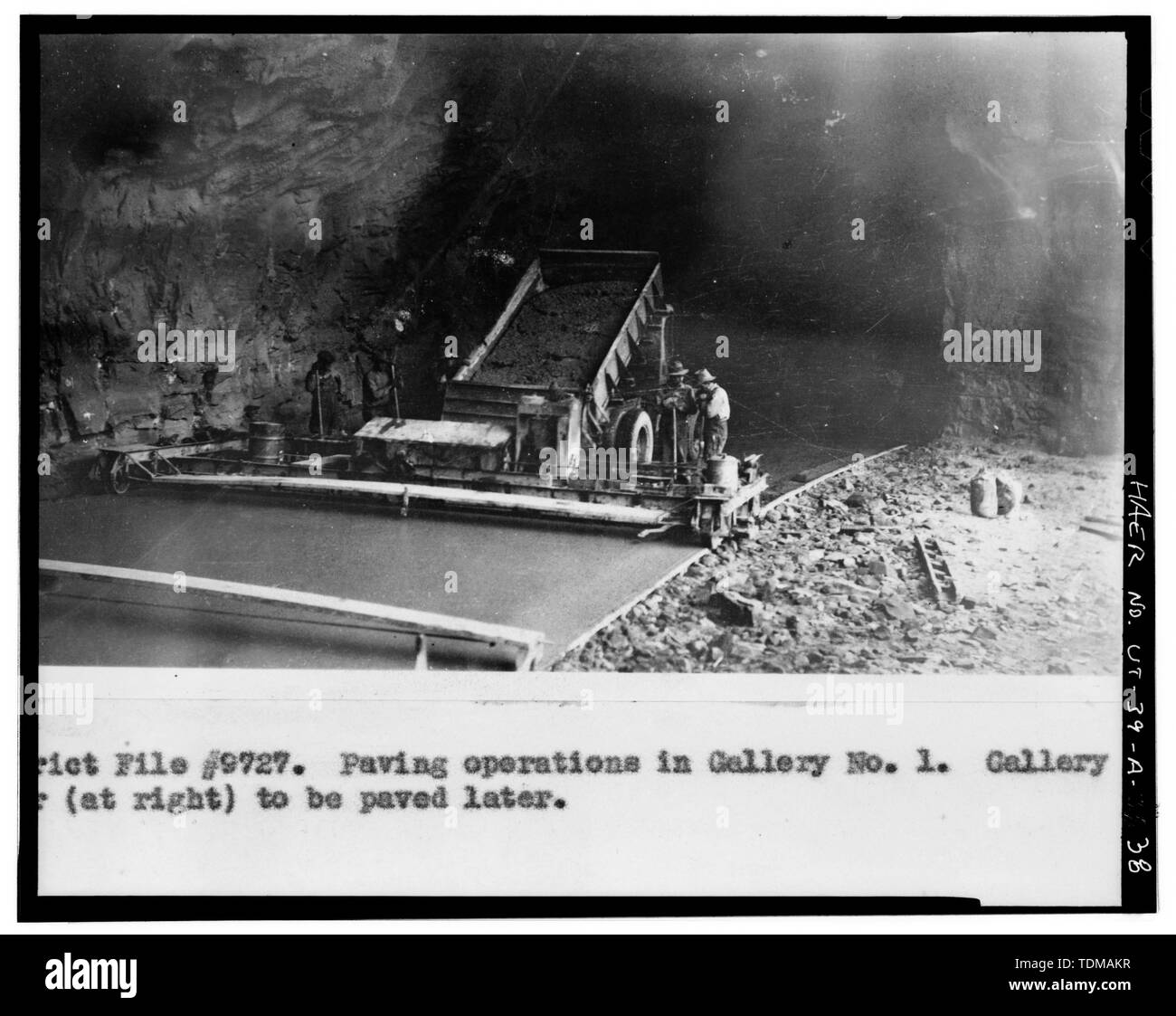 PAVING OPERATIONS IN GALLERY NO. 1 - Zion-Mount Carmel Highway, Tunnel, Two miles east of Zion Canyon Scenic Drive, Springdale, Washington County, UT; Nevada Construction Company; Bureau of Public Roads; Finch, J B; Mitchell, R R; Campbell, K B; Jones, T A; Scott, R N; Gregory, Herbert E; Cement Gun Construction Company; US Geologrical Service; US Bureau of Mining; Crane, W R; Reynolds-Ely Construction Co; Case Construction Company; Shea and Shea; Jurale, James, historian; Fraser, Clayton B, photographer; Anderson,  Michael, historian; Grogan, Brian C, photographer Stock Photo
