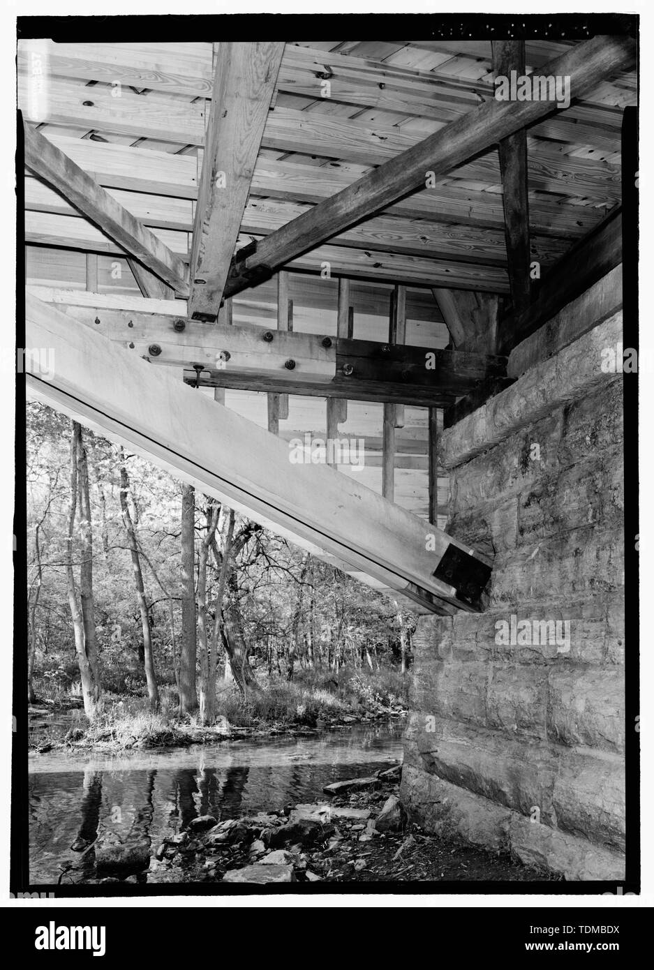 PERSPECTIVE OF ABUTMENT AT NORTHEAST CORNER FROM SOUTHWEST. - Forsythe Bridge, Spanning Big Flat Rock Creek, CR 650S, Moscow, Rush County, IN; Kennedy, Emmett L; Burr, Theodore; Yule, Robert B; Smith Bridge Company; Columbus Company; Bussell, Smith; Keating, James; Kennedy, Archibald McMichaels; EL Kennedy and Sons; JA Barker Engineering Inc; Christianson, Justine, transmitter; Marston, Christopher, project manager; Federal Highway Administration, sponsor Stock Photo