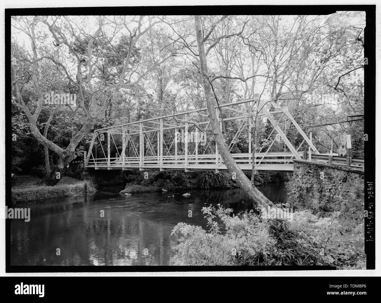 PERSPECTIVE VIEW FROM SE, SITE CONTEXT. - Peevy Road Bridge, Peevy Road spanning Perkiomen Creek in Upper Hanover Township, East Greenville, Montgomery County, PA; Morrison, David H; Columbia Bridge Works; Moser, Amos D; Frank, Noah D; Davis, Jesse B; Conrad, H R; Yeakel, Hiram; Snyder, Monroe; Morrison, Charles C; Murphy, John; Flores, Roland S, field team project manager; Croteau, Todd, project manager; Pennsylvania Department of Transportation PENNDOT), sponsor; Pennsylvania Historical and Museum Commission, sponsor; Christianson, Justine, transmitter; Phipps, Linda S, historian; Lowe, Jet, Stock Photo