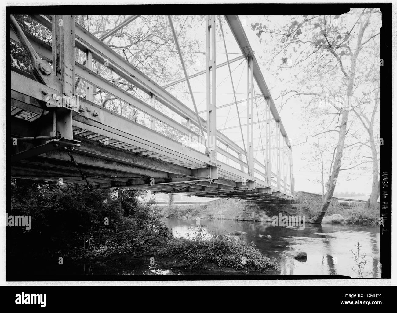 PERSPECTIVE VIEW FROM SW, BELOW DECK. NOTE PIN CONNECTIONS. - Peevy Road Bridge, Peevy Road spanning Perkiomen Creek in Upper Hanover Township, East Greenville, Montgomery County, PA; Morrison, David H; Columbia Bridge Works; Moser, Amos D; Frank, Noah D; Davis, Jesse B; Conrad, H R; Yeakel, Hiram; Snyder, Monroe; Morrison, Charles C; Murphy, John; Flores, Roland S, field team project manager; Croteau, Todd, project manager; Pennsylvania Department of Transportation PENNDOT), sponsor; Pennsylvania Historical and Museum Commission, sponsor; Christianson, Justine, transmitter; Phipps, Linda S, h Stock Photo
