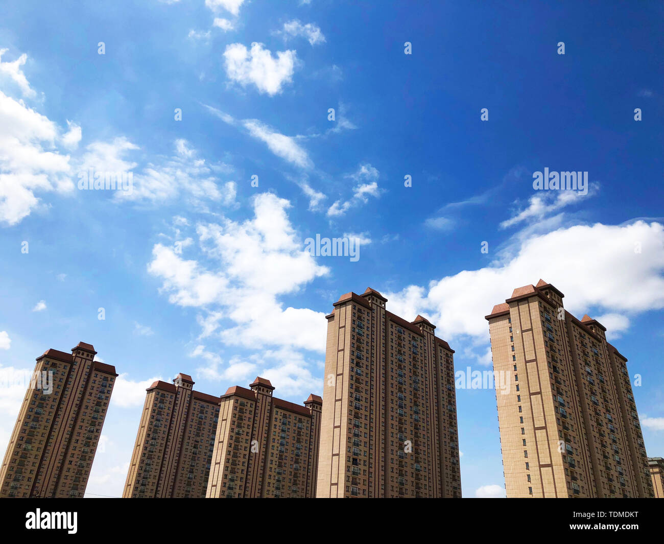 Residential buildings under the blue sky Stock Photo - Alamy