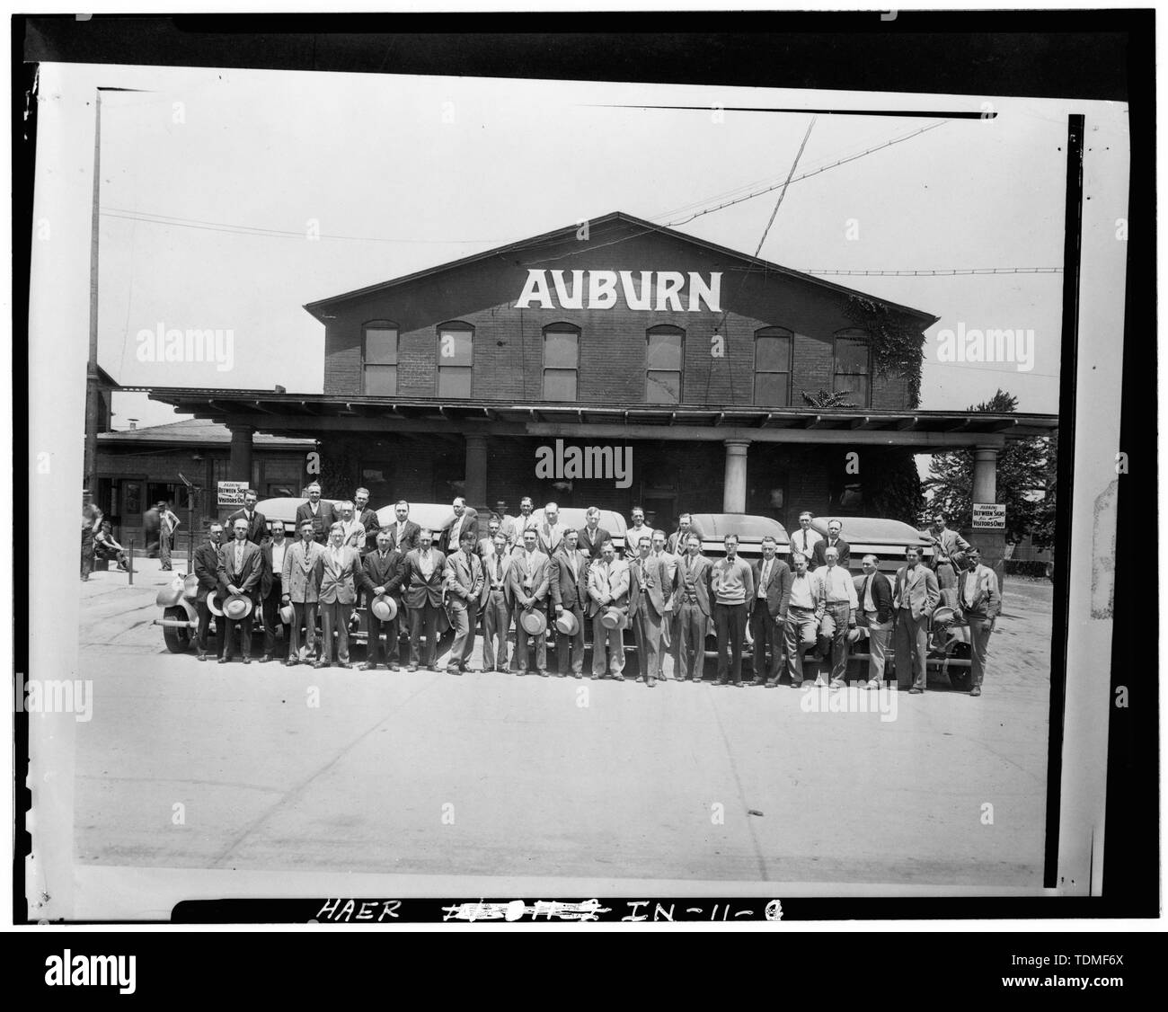 PHOTOCOPY OF CA. 1928 GROUP PHOTOGRAPH IN FRONT OF OFFICE BUILDING AS AUBURN MOTOR CO. - Lexington Motor Company, Eighteenth Street and Columbia Avenue, Connersville, Fayette County, IN; Lexington-Howard Company; Cord, Errett Lobban; Moore, John C; Stone , Kinsey; Boucher, Jack E; Rosenberg, Robert; Sackheim, Donald Stock Photo