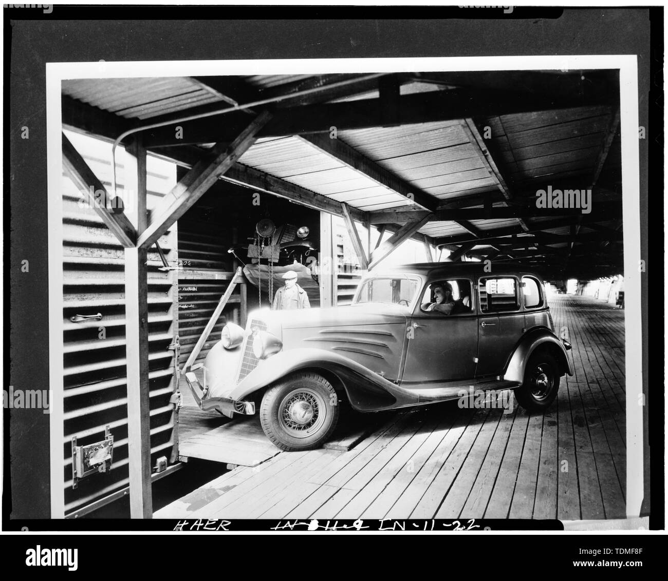 PHOTOCOPY OF CA. 1934 VIEW OF AUTO ON FREIGHT-CAR LOADING DOCK - Lexington Motor Company, Eighteenth Street and Columbia Avenue, Connersville, Fayette County, IN; Lexington-Howard Company; Cord, Errett Lobban; Moore, John C; Stone , Kinsey; Boucher, Jack E; Rosenberg, Robert; Sackheim, Donald Stock Photo