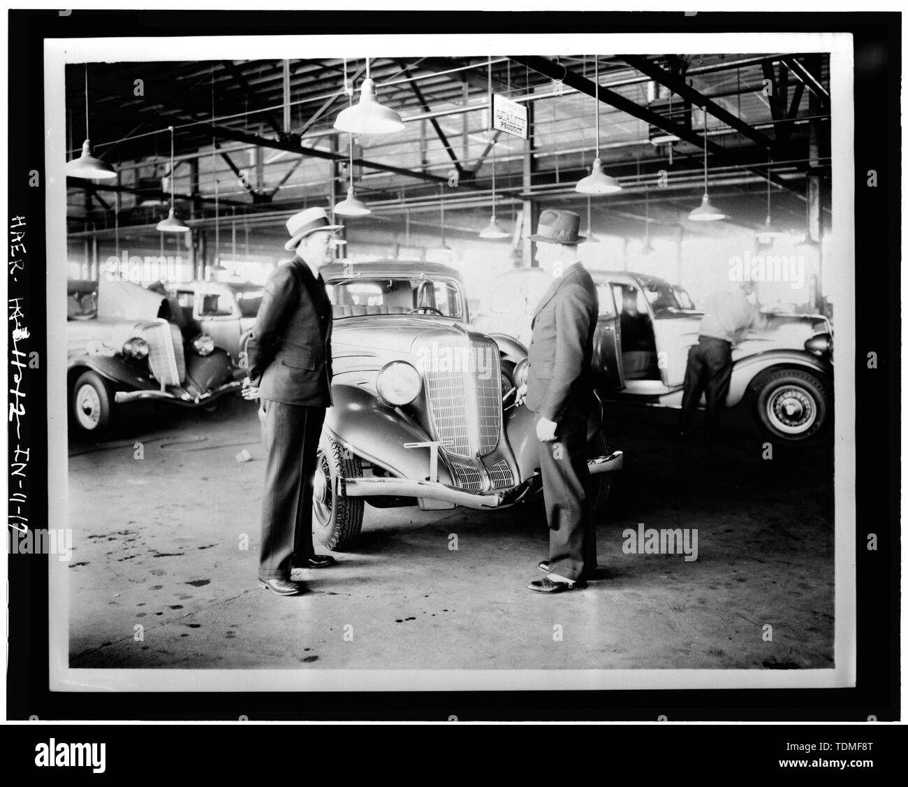 PHOTOCOPY OF CA. 1934 VIEW OF AUTOS, AUTO COMPANY OFFICIALS, IN FRONT OF FINISHED AUTO - Lexington Motor Company, Eighteenth Street and Columbia Avenue, Connersville, Fayette County, IN; Lexington-Howard Company; Cord, Errett Lobban; Moore, John C; Stone , Kinsey; Boucher, Jack E; Rosenberg, Robert; Sackheim, Donald Stock Photo