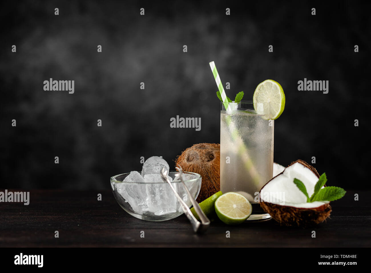 Coconut water drink on dark background Stock Photo