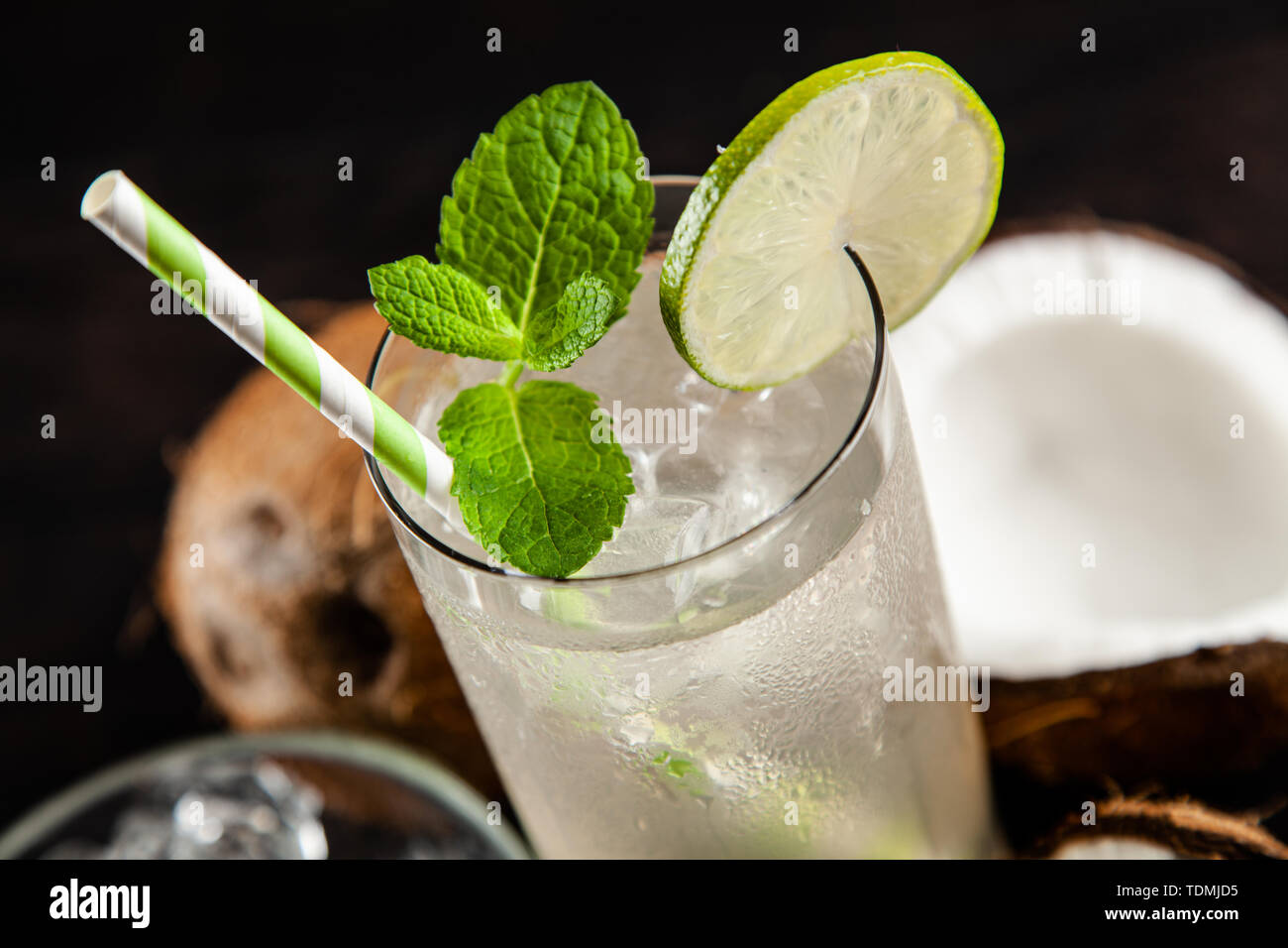Coconut water drink on dark background Stock Photo