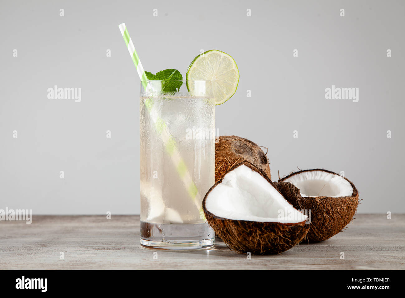 Coconut water drink on wooden background Stock Photo