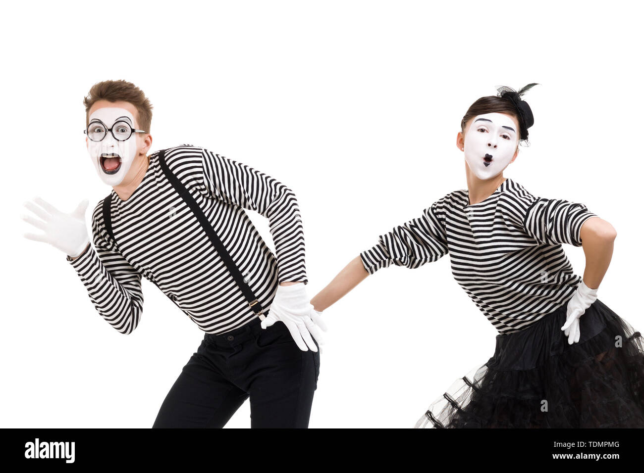 mimes in striped shirts. Man and woman dressed as actors of pantomime