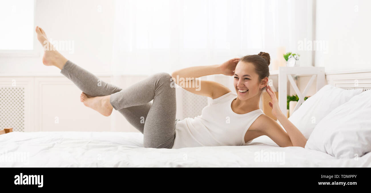 Morning Workout. Woman Doing Abs Exercise On Bed Stock Photo Alamy