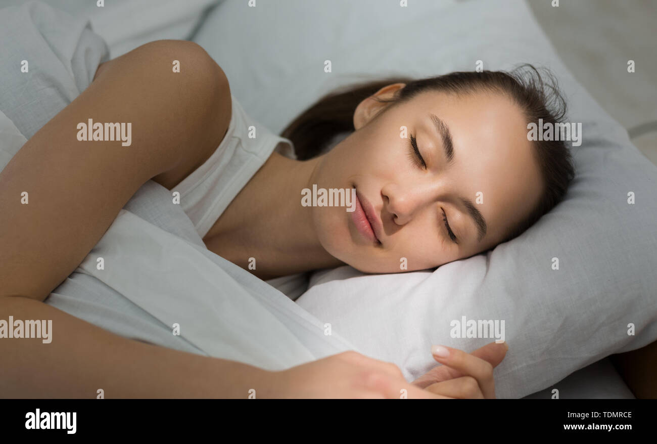 Rest Reinstatement For Active Life. Woman Sleeping In Bed Stock Photo