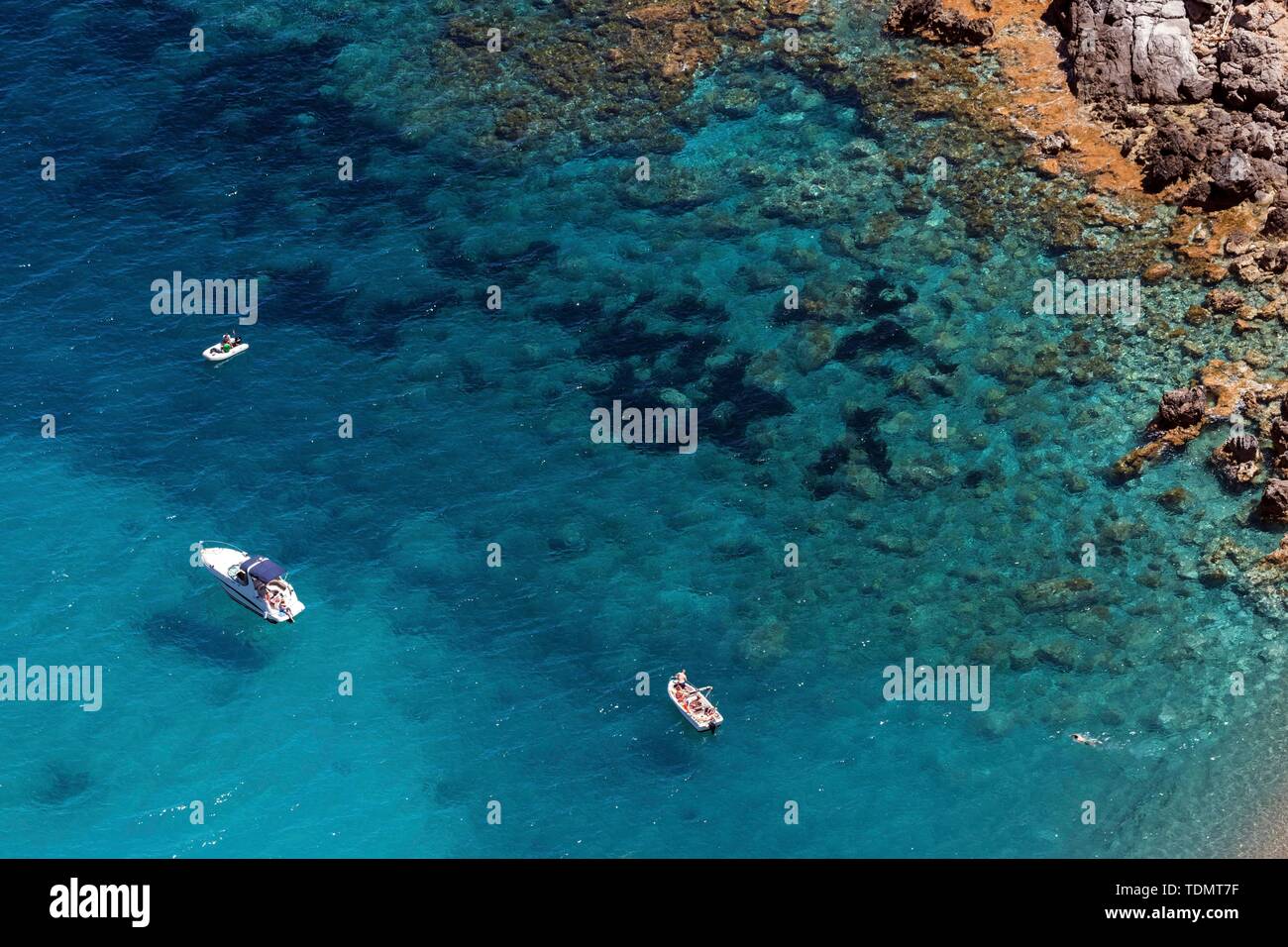 Boats anchoring at the beach Platja of the Coll Baix in the turquoise blue water, peninsula near Alcudia, Majorca, Balearic Islands, Spain Stock Photo