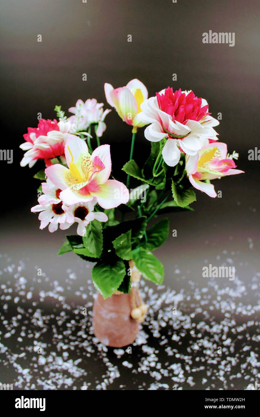 Clay Vase Painted With Different Types Of White And Red Flowers