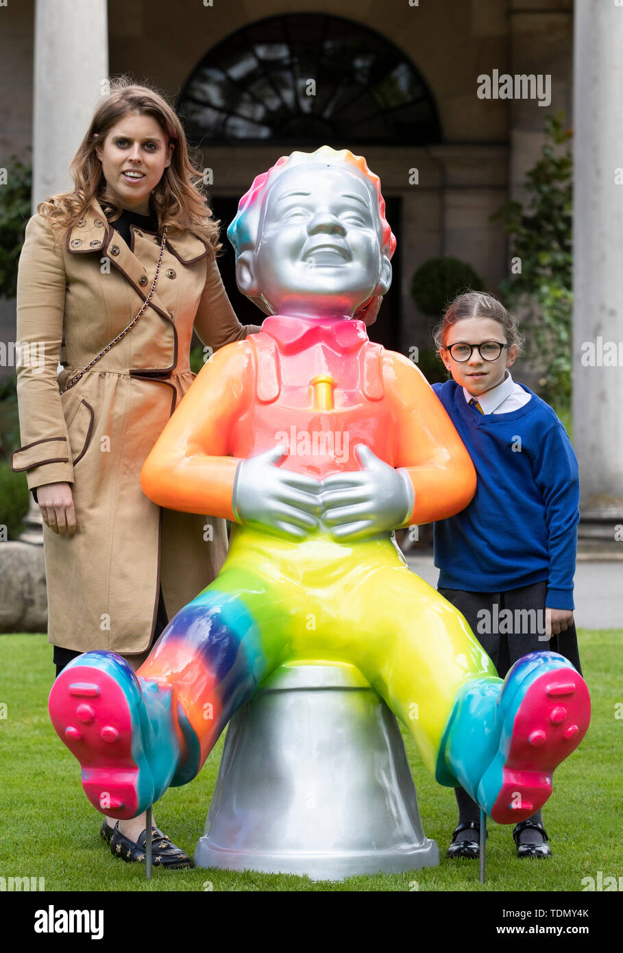 Princess Beatrice, with Alyssa Brannan, 8, from Prestonfield Primary School who designed the 'Rainbow Oor Wullie' attends a photo call for the launch of the Oor Wullie's Big Bucket Trail, outside Prestonfield House Hotel in Edinburgh, one of several life-sized sculptures of the favourite comic book character on a public art trail. Stock Photo