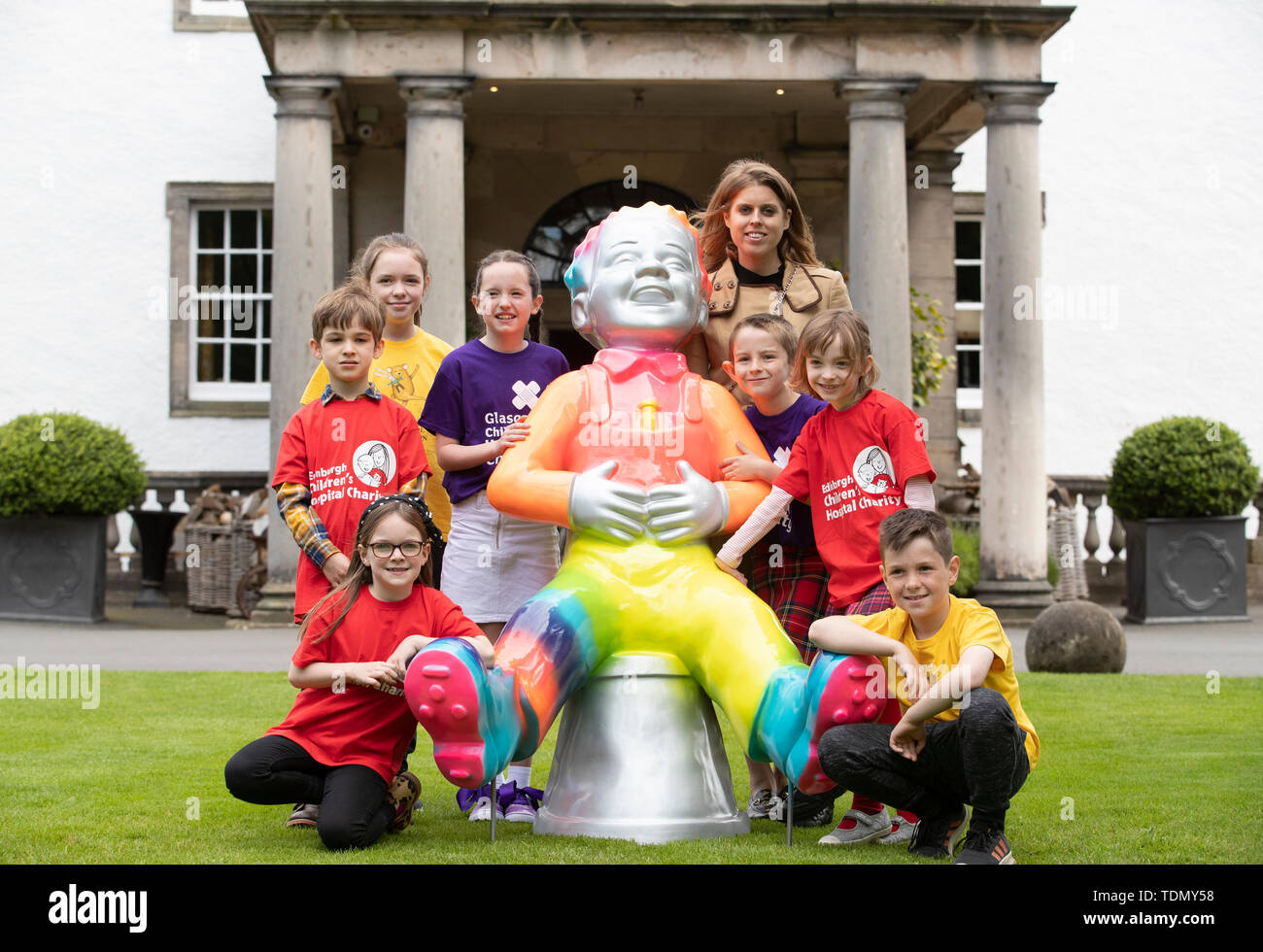 Princess Beatrice, along with children from Scotland's children's hospital charities, attends a photo call for the launch of the Oor Wullie's Big Bucket Trail, outside Prestonfield House Hotel in Edinburgh, one of several life-sized sculptures of the favourite comic book character on a public art trail. Stock Photo