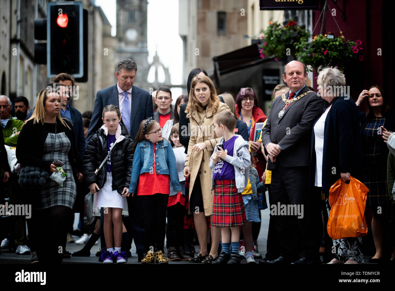 Princess Beatrice walks down Edinburgh's Royal Mile with children from Scotland's children's hospital charities as she takes part on the Oor Wullie's Big Bucket Trail to find one of several life-sized sculptures of the favourite comic book character on a public art trail in the city. Stock Photo