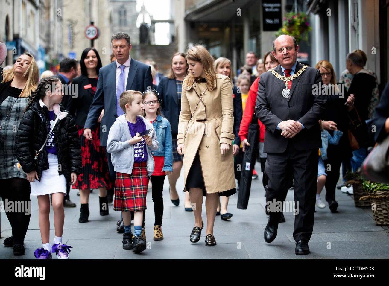 Princess Beatrice walks down Edinburgh's Royal Mile with children from Scotland's children's hospital charities as she takes part on the Oor Wullie's Big Bucket Trail to find one of several life-sized sculptures of the favourite comic book character on a public art trail in the city. Stock Photo