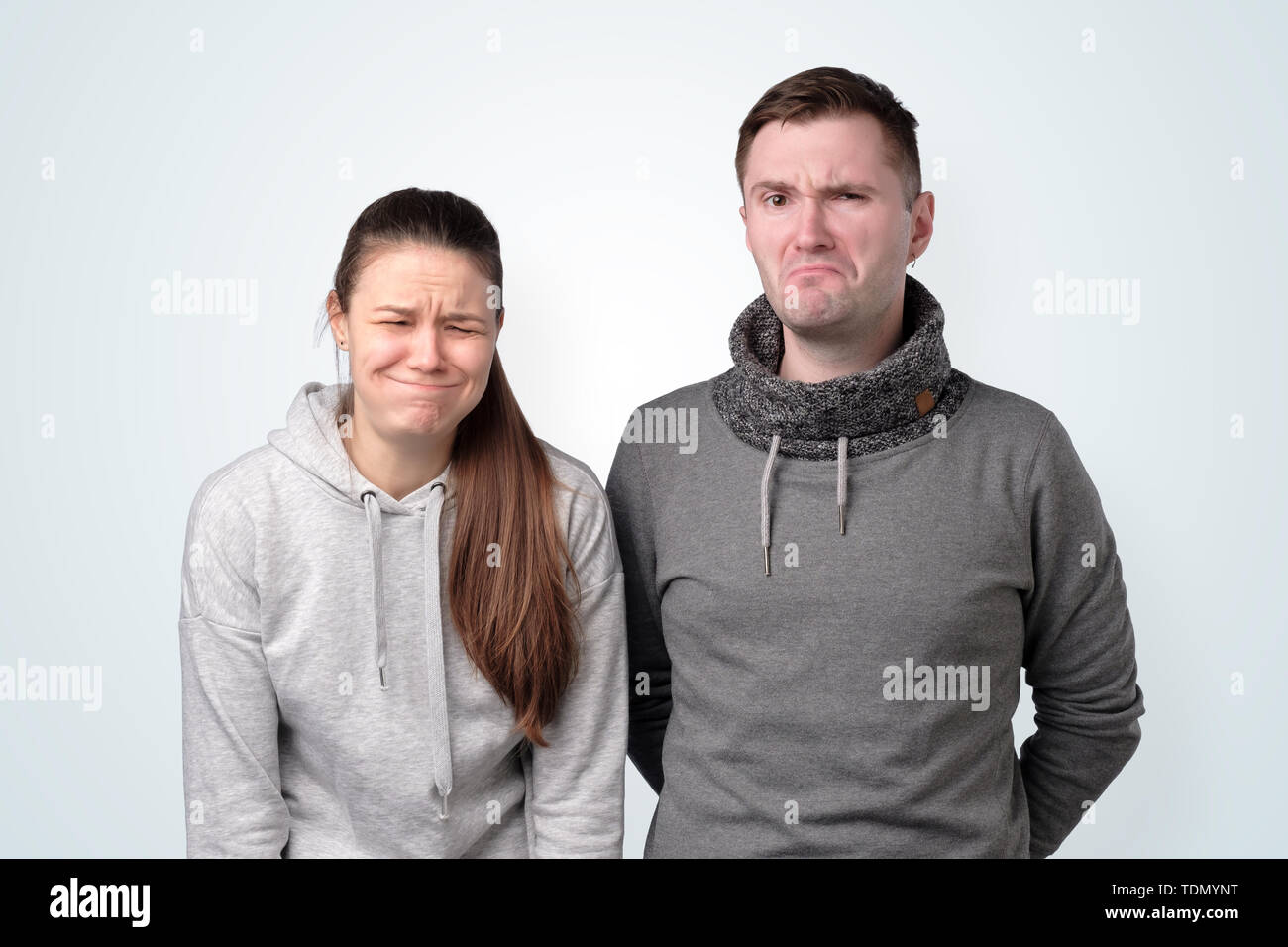 Depressed young couple having relationship troubles. Studio shot Stock Photo